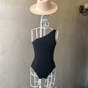 Super down one shoulder backless bodysuit.  Never worn.